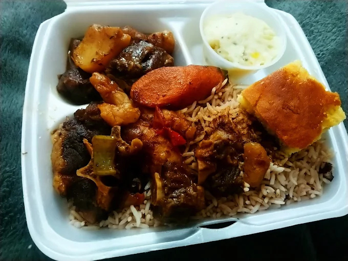 Oxtail - Slow-braised oxtail in rich gravy with butter beans and traditional Caribbean seasonings